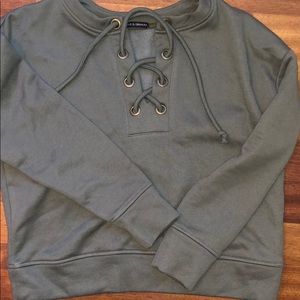 green tie up sweater